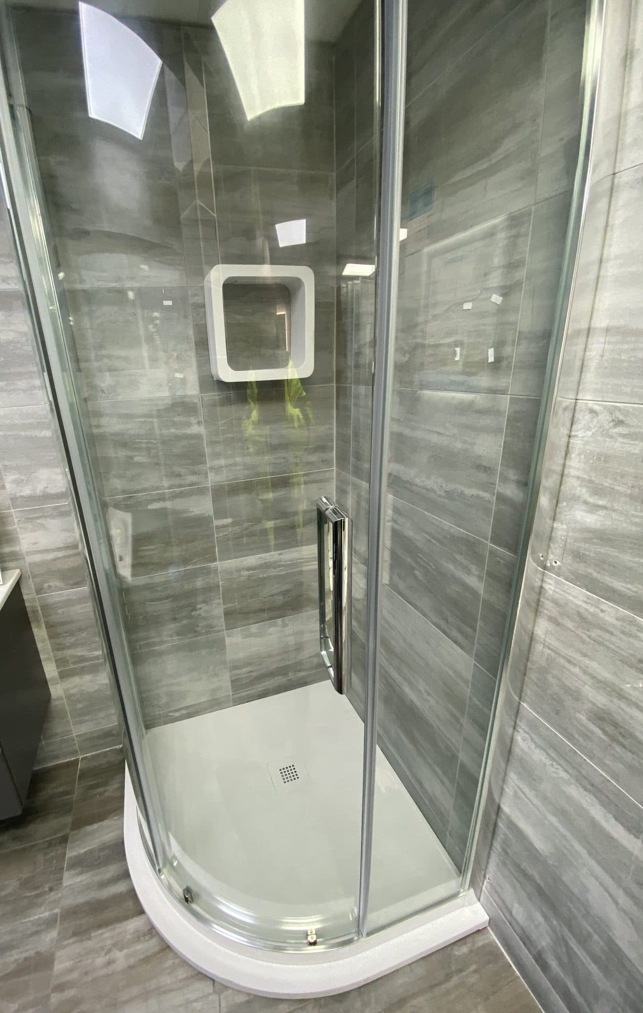 Quadrant shower enclosure with full-height tiling
